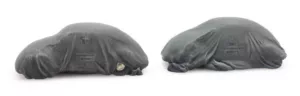 Lading: 2 VW Kevers onder dekzeil